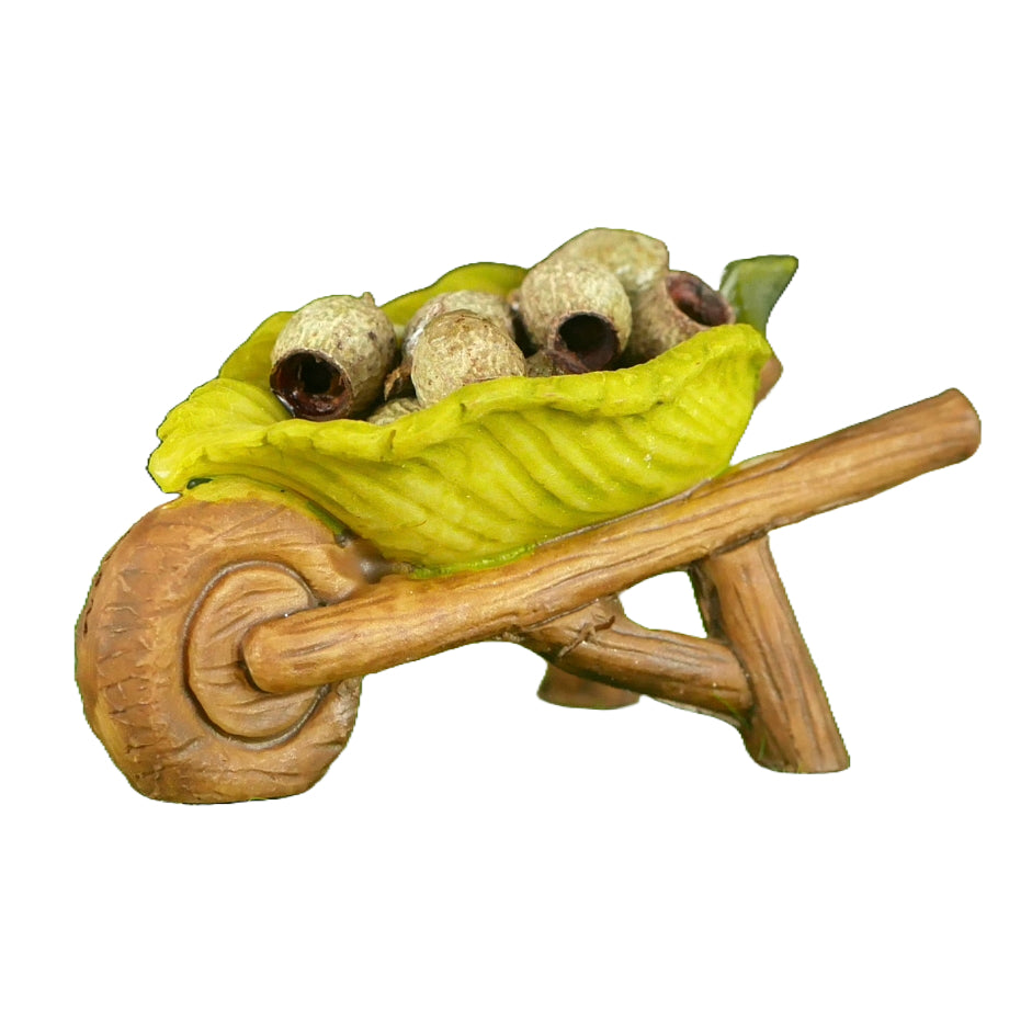 Fairy Garden Wheelbarrow decoration with wood type frame and a green leaf for the barrow. Includes some small gumnuts to fill the wheelbarrow.